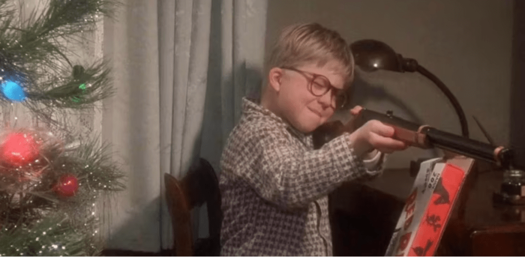 Ralphie from a Christmas Story holding an air rifle