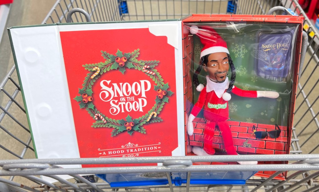 Snoop on the stoop doll and packaging in a shopping cart