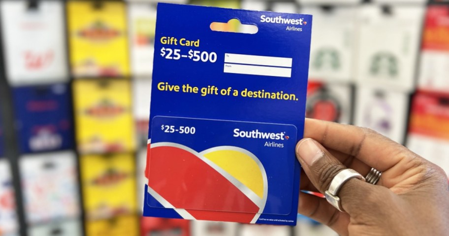 hand holding up a blue Southwest Airlines gift card