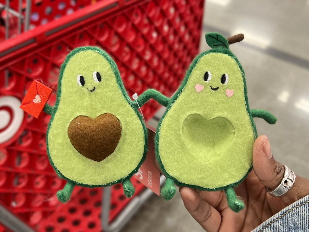 holding two felt avocados holding hands