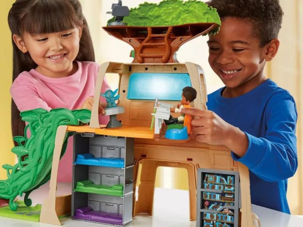 two kids playing with the Star Wars Jedi Training Playset