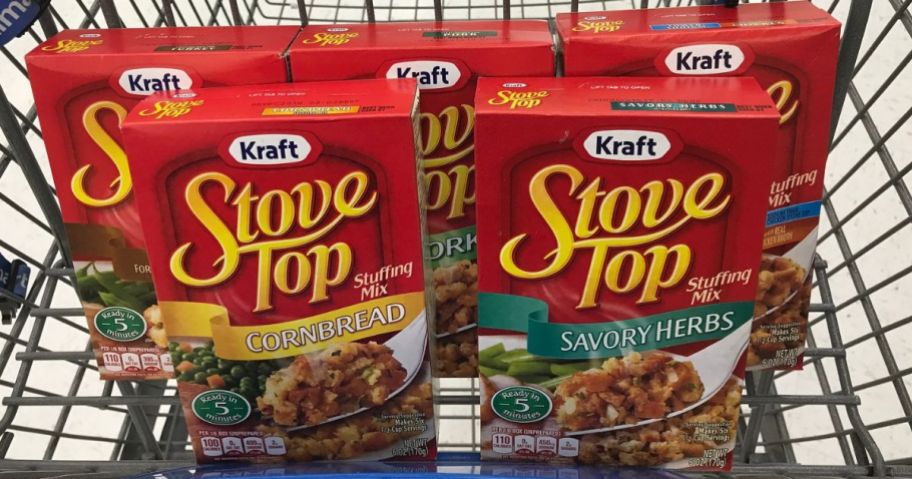 Boxes of different flavors of Stove Top Stuffing in the front basket of a shopping cart