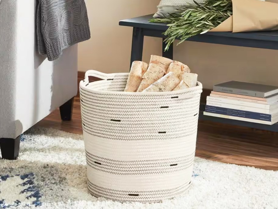 white and black rope storage basket on floor