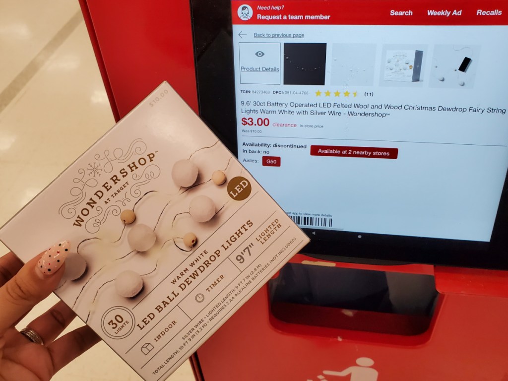 Women scanning Christmas ornaments at target price scanner