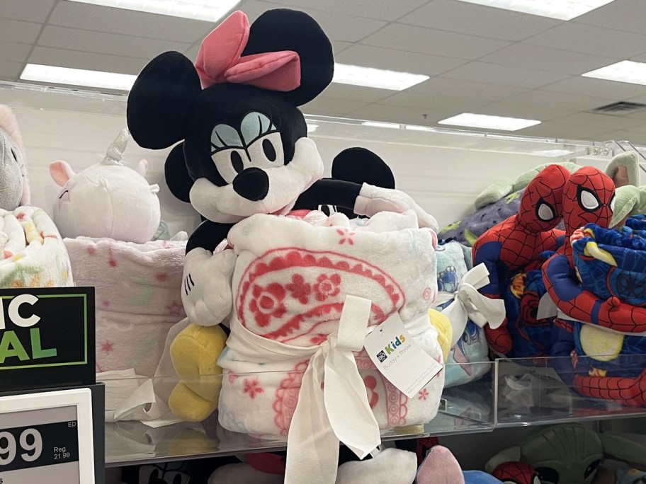 minnie mouse plush and blanket set on store shelf