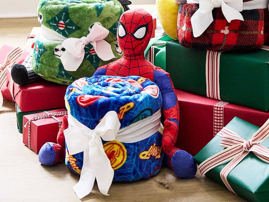 spider man plush and blanket set near christmas presents