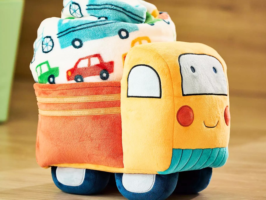 truck plush with a throw blanket in the bed