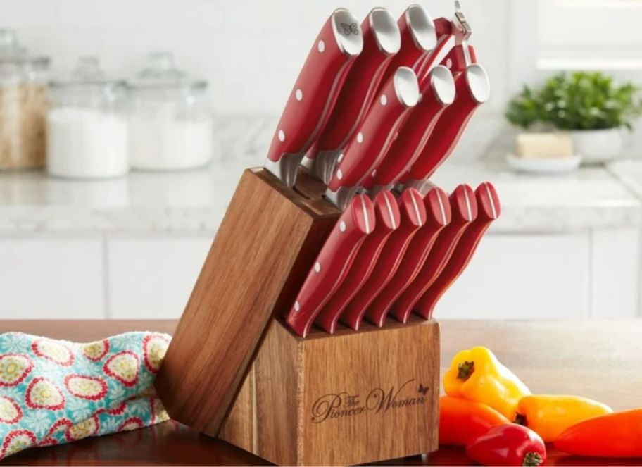 a red stainless steel knife block set