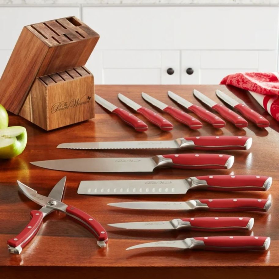 a red stainless steel knife block set