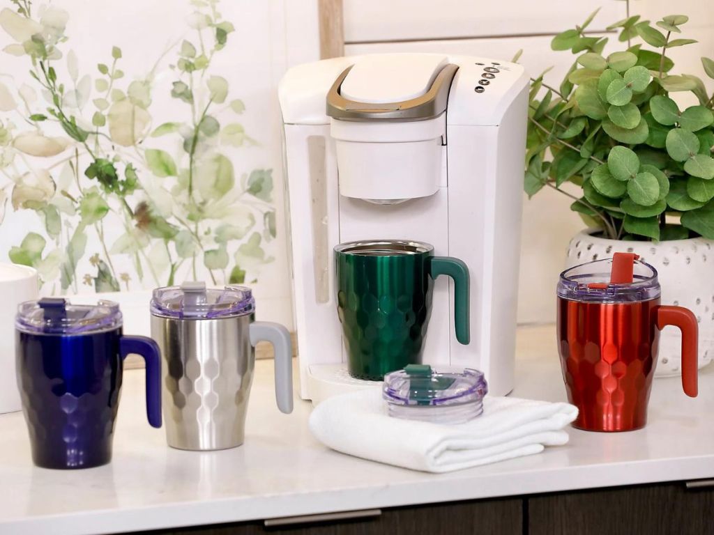 Primula insulated travel mugs with one set under a keurig brewer