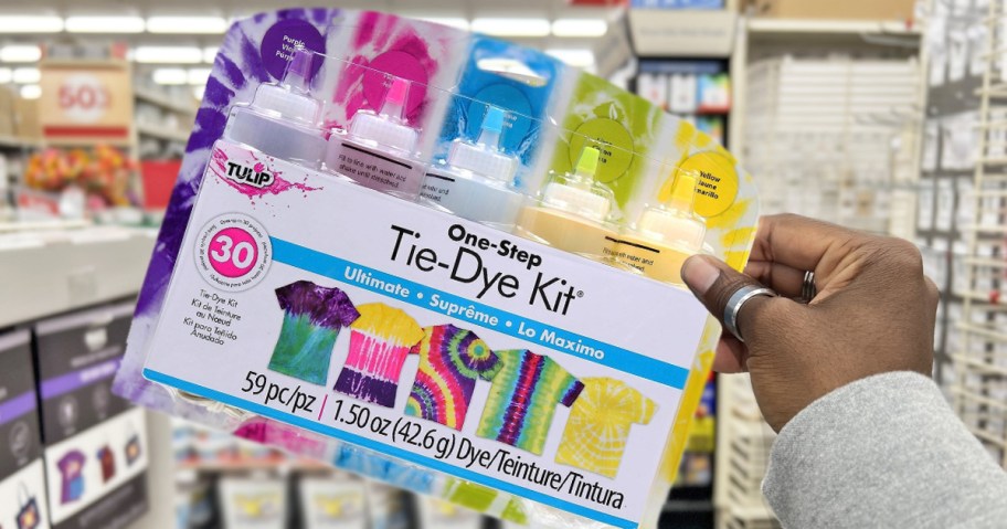 hand holding up a Tulip Tie Dye Kit in store