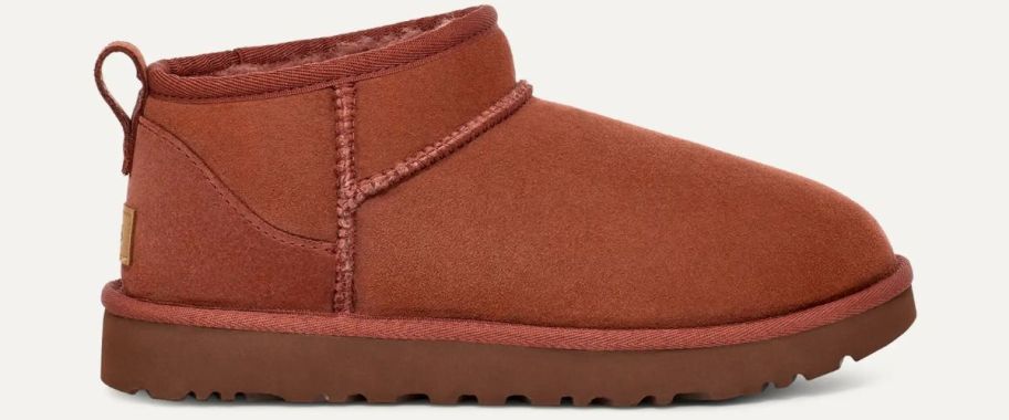 A reddish-brown UGG shoe