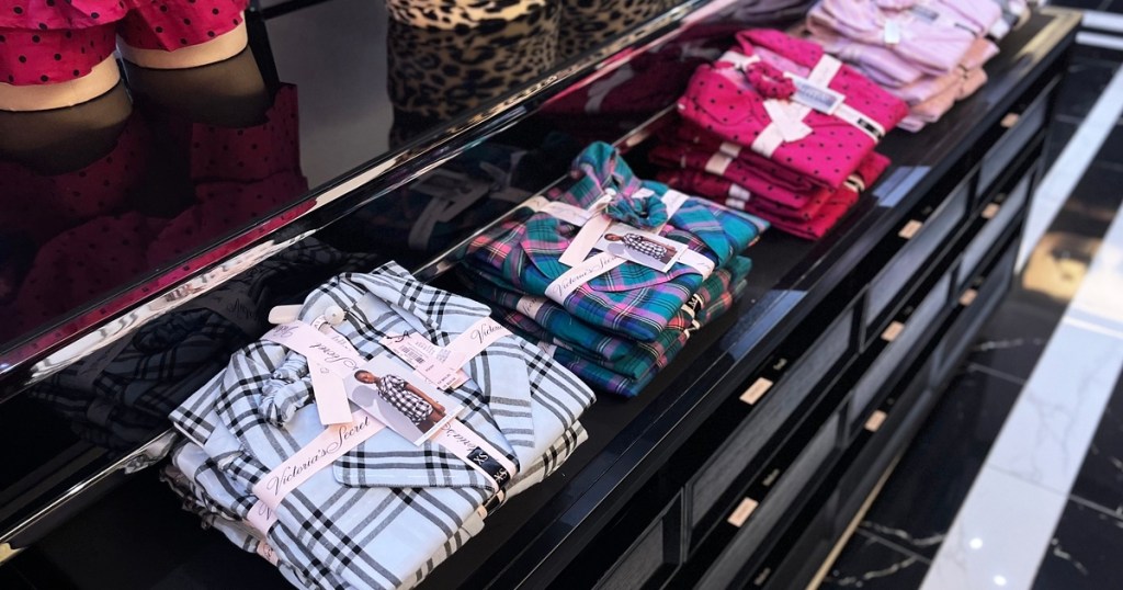 folded sets of Victoria's Secret Sleepwear Pajamas in store