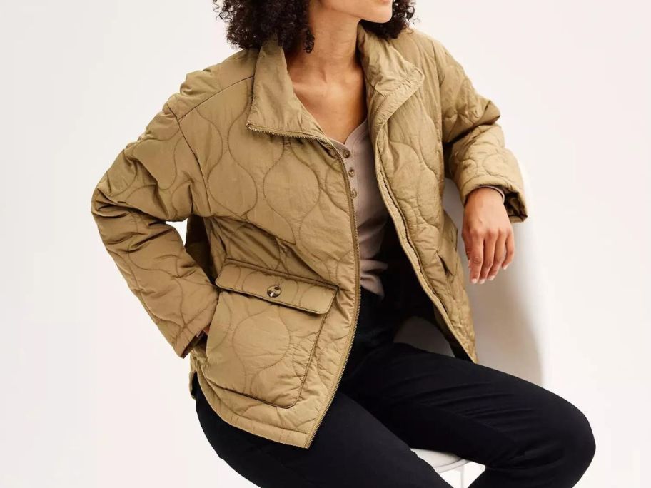 A woman wearing a Sonoma Goods For Life Quilted Jacket in tan