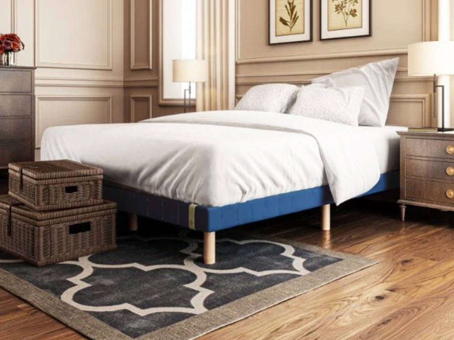 bed on a blue foundation in bedroom