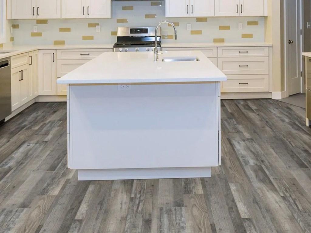 gray hardwood floor in white kitchen cabinets