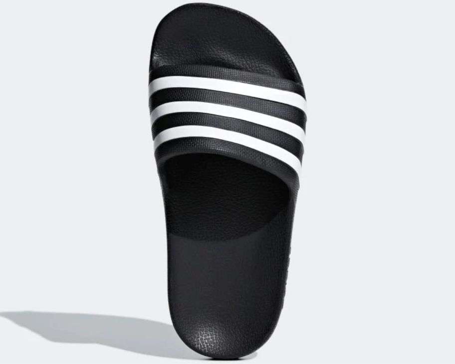 a black and white kids slide shoe