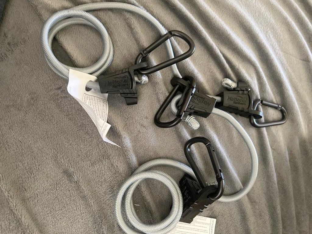 two gray adjustable bungee cords