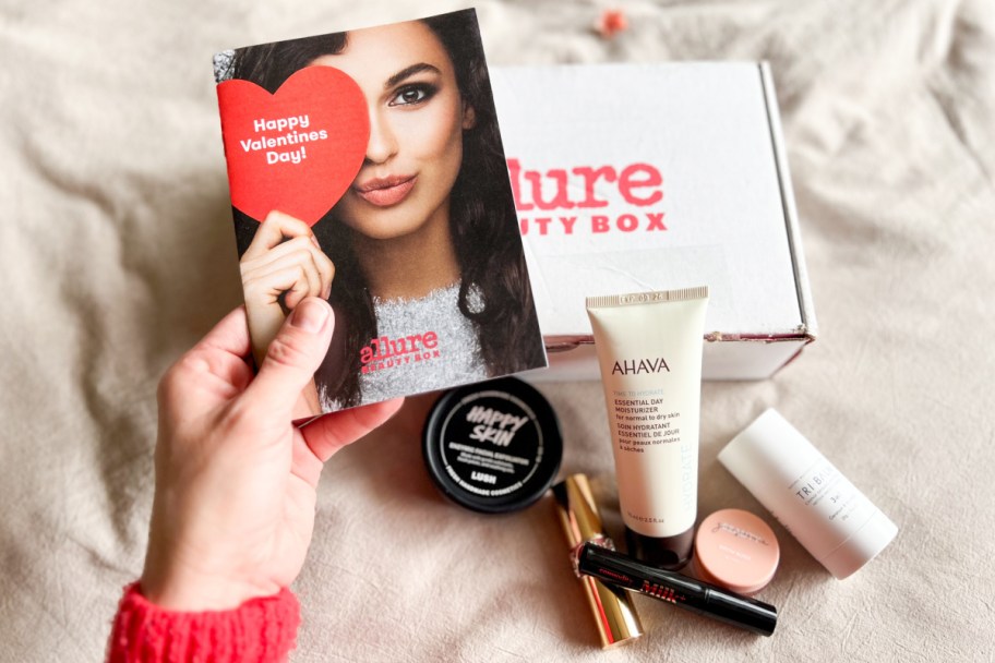 hand holding allure beauty box pamphlet