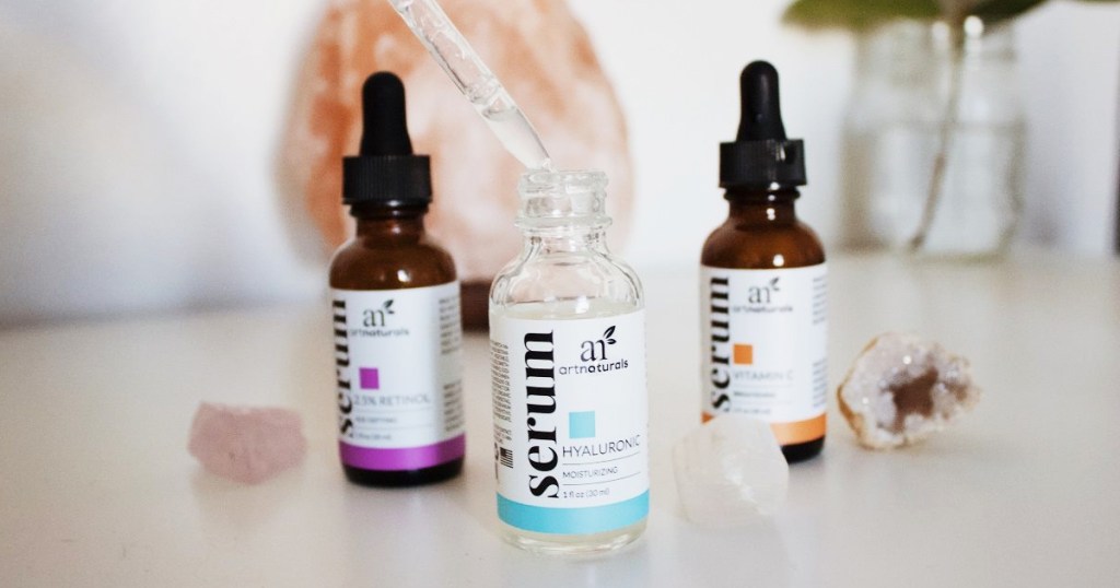 three facial serums near crystals