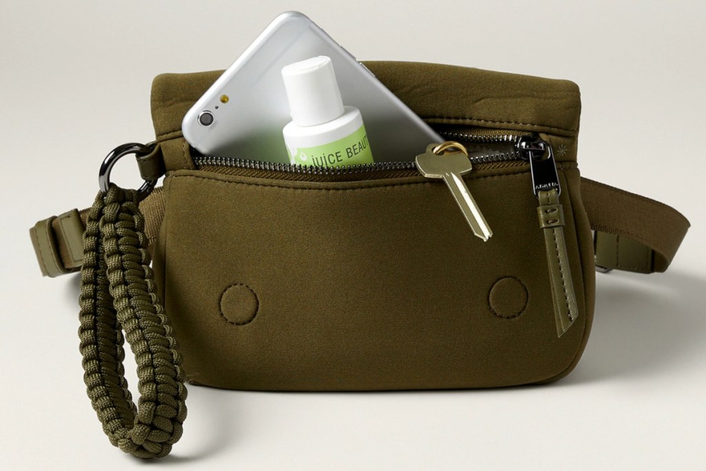 army green purse with phone inside