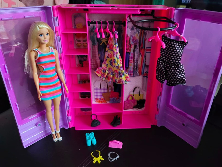 barbie with closet full of barbie clothes