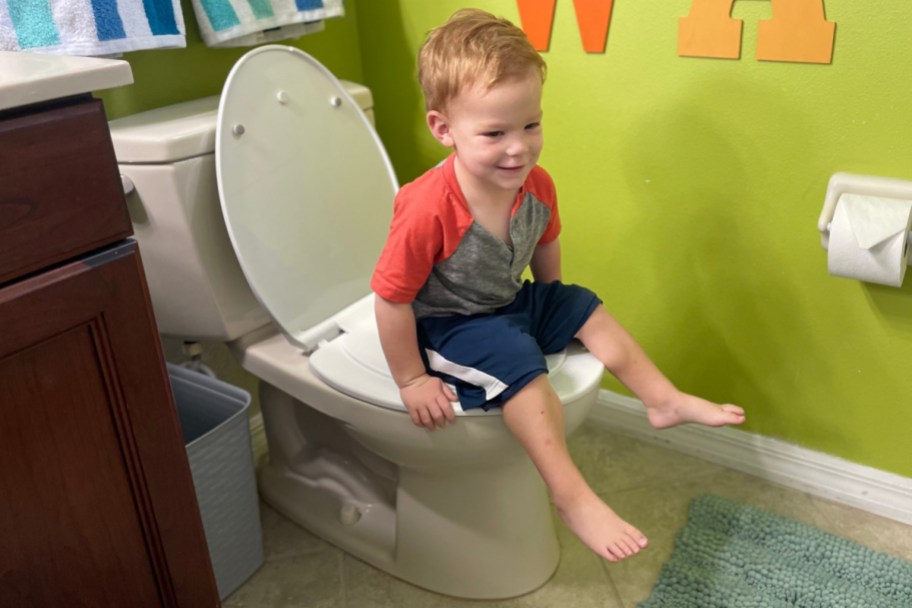 toddler on kid size toilet seat