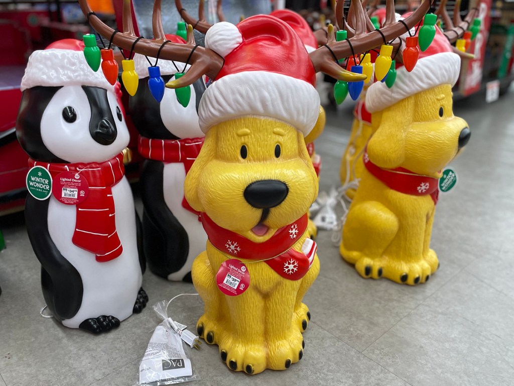 dog mold wearing santa hat with reindeer ears