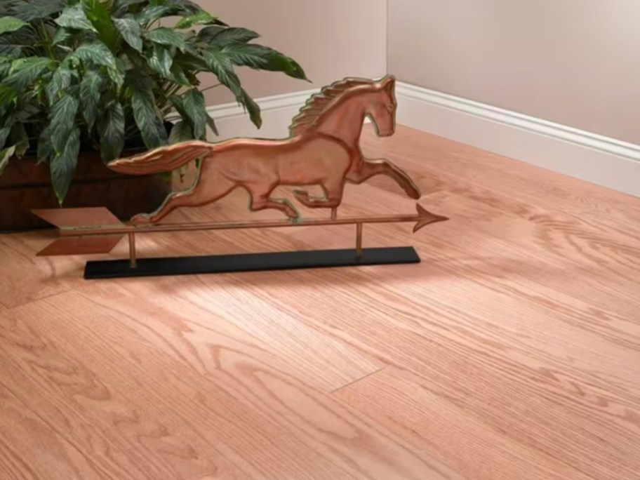light hardwood floor with horse decor