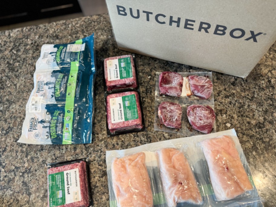 various packages of butcherbox meat on a countertop