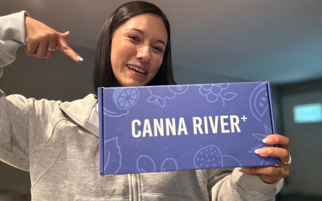woman pointing to canna river box