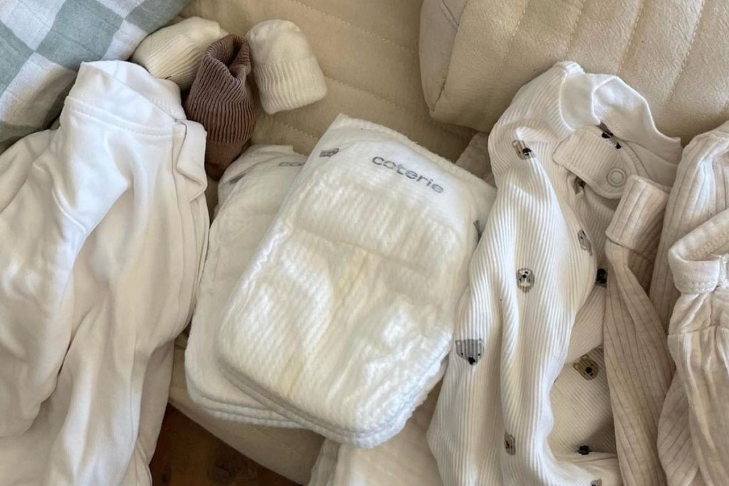 baby diaper next to clothes and accessories