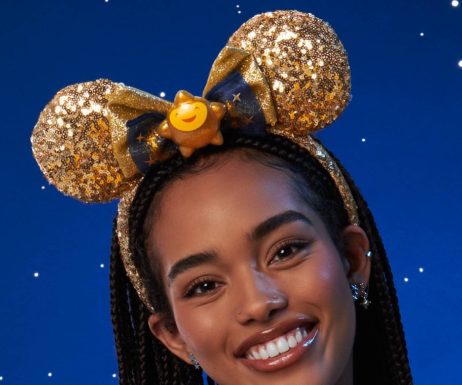 woman wearing sequined gold mickey ear headband