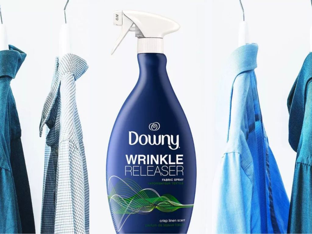 bottle of downy wrinkle release next to hanging clothes