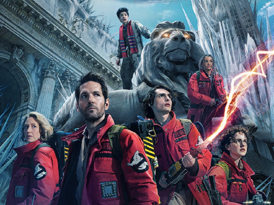 people posing in red coveralls for ghostbusters frozen empire movie poster