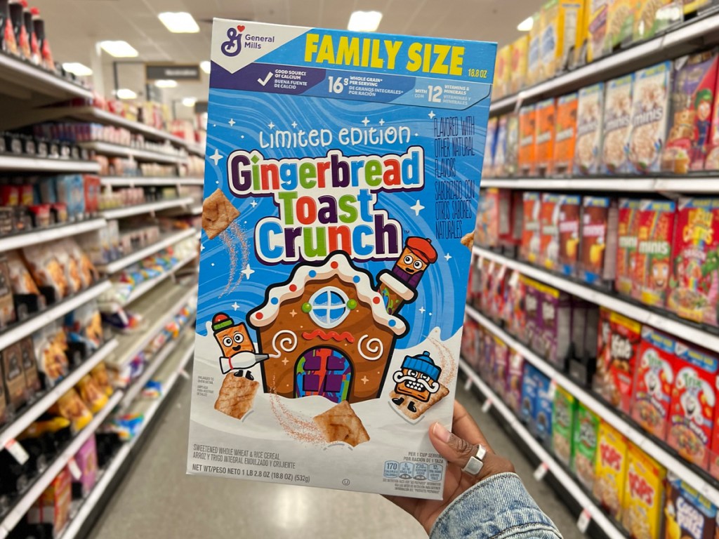 hand holding gingerbread toast crunch cereal box