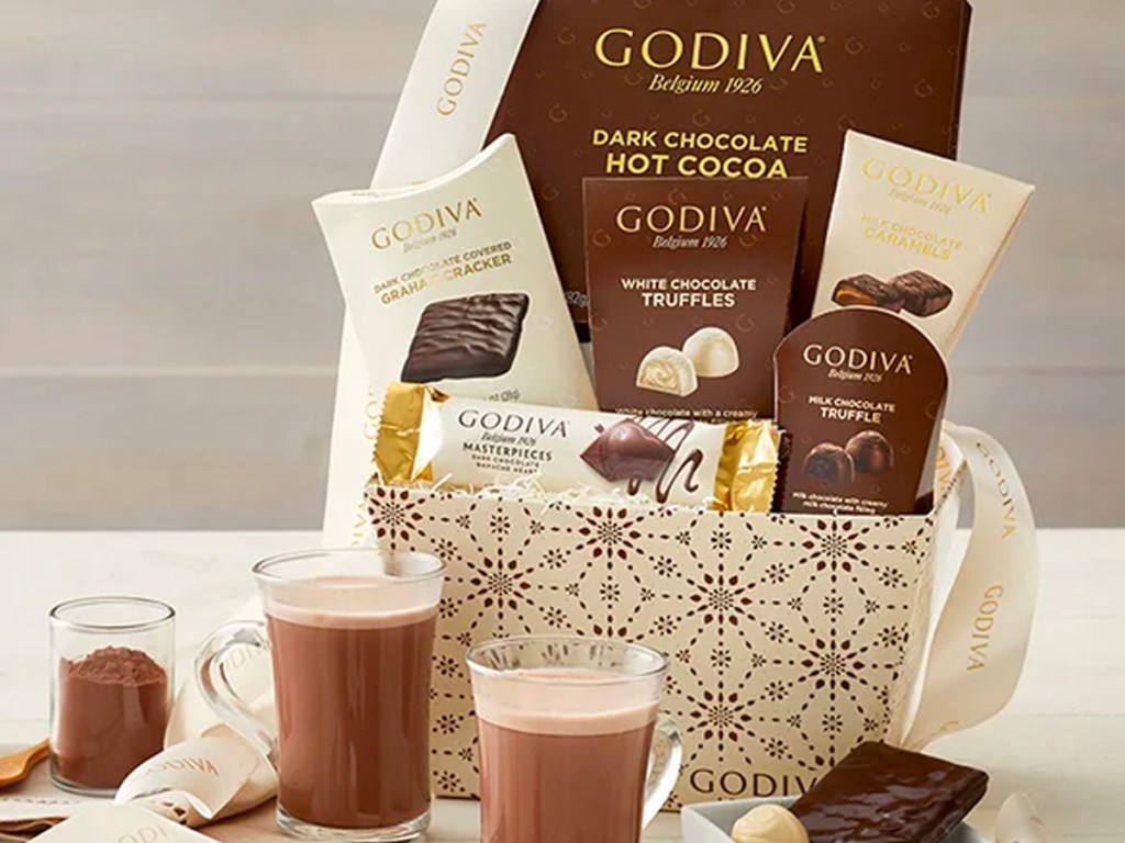 godiva gift basket with candy and cups of hot chocolate