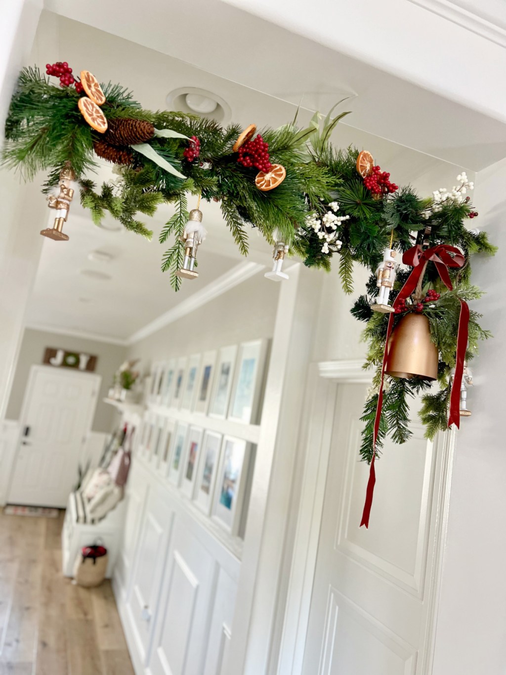 hanging garland in a doorway using a tension rod