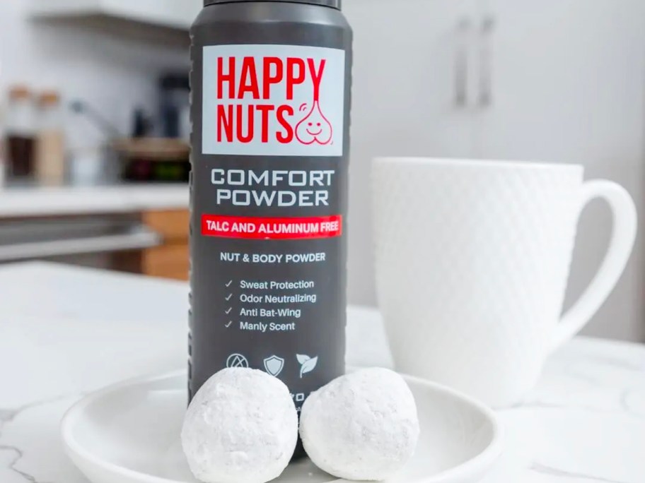 happy nuts comfort powder bottle on counter next to coffee mug