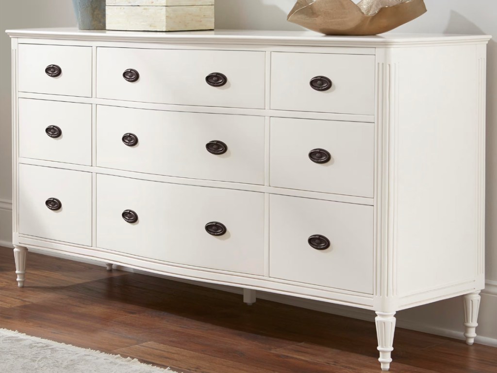 ivory dresser with 12 drawers in bedroom
