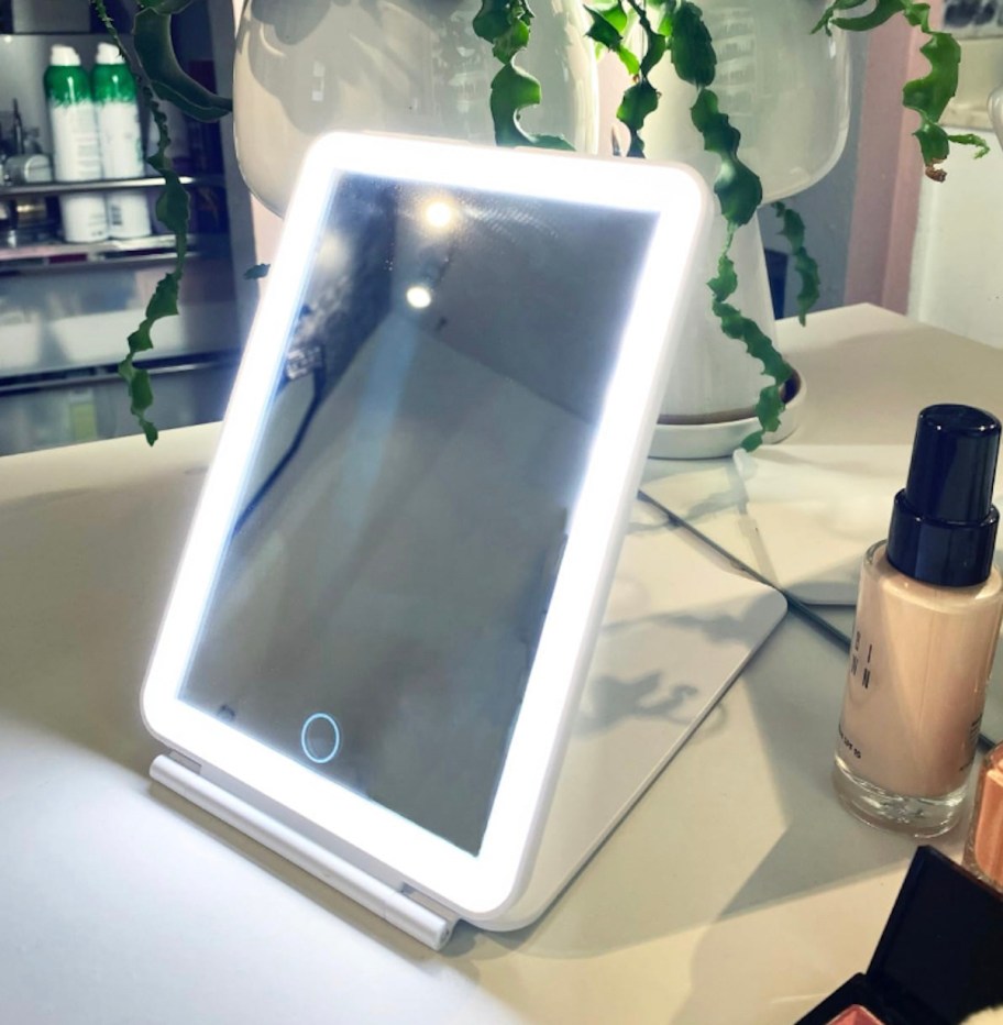 vanity mirror on beauty counter with lights