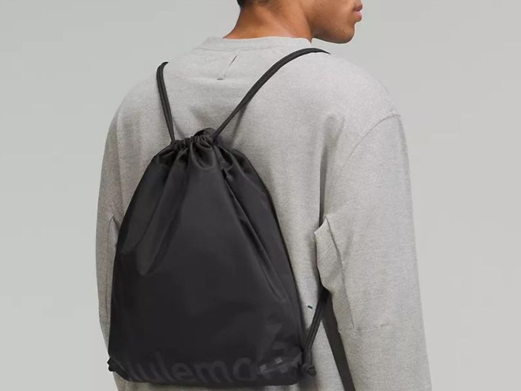 man wearing a lululemon gym sack on his back