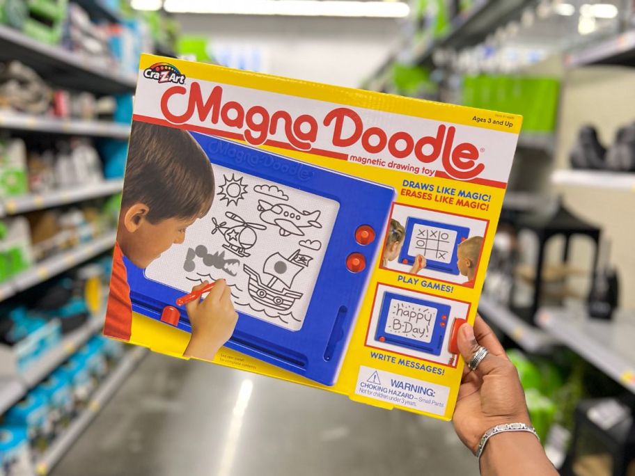 Cra-Z-Art Retro MagnaDoodle box being held by hand in aisle