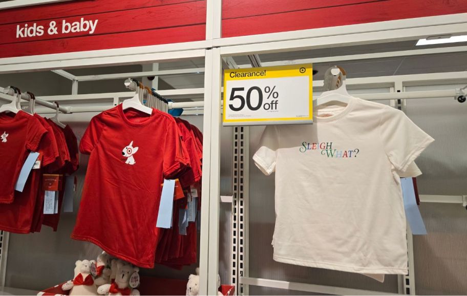 matching fam pj shirts on a wall display in a store