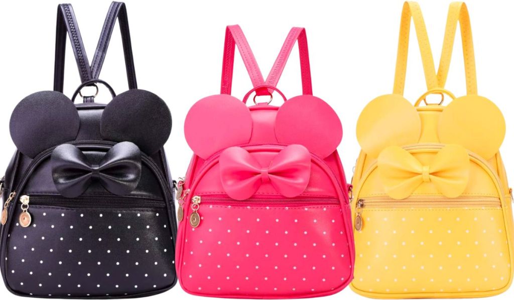 3 mini backpacks in black hot pink and yellow stock images