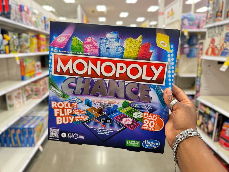 hand holding monopoly chance board game 