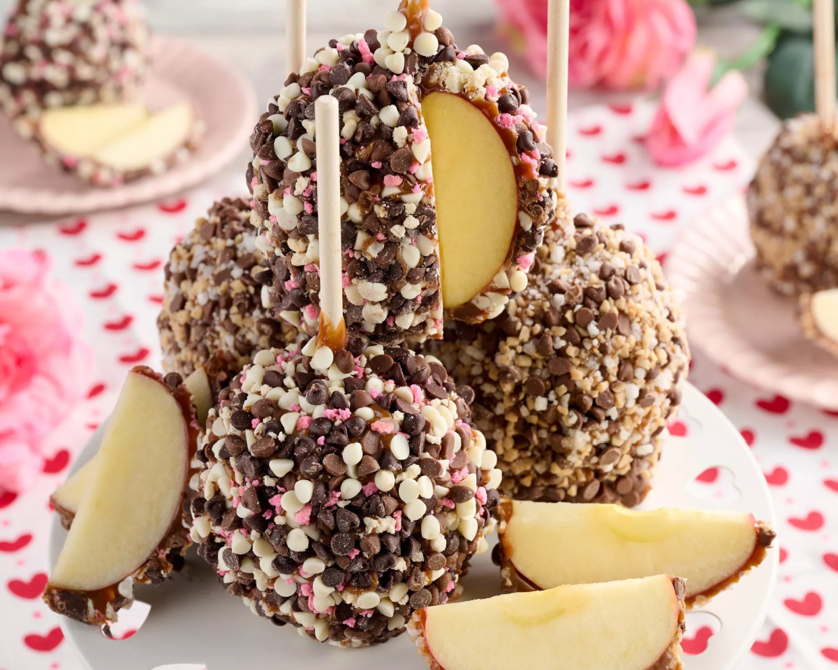 candy coated caramel apple with piece cut out