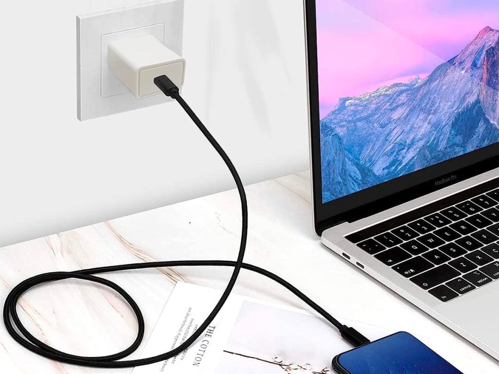 phone plugged into white wall charger