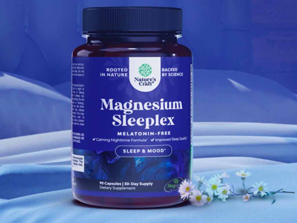 natures craft magnesium sleeplex bottle on bed next to flowers