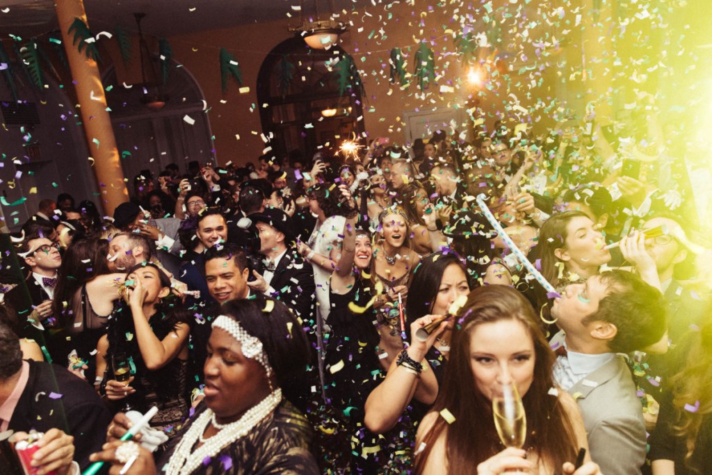 people at new years eve party with confetti